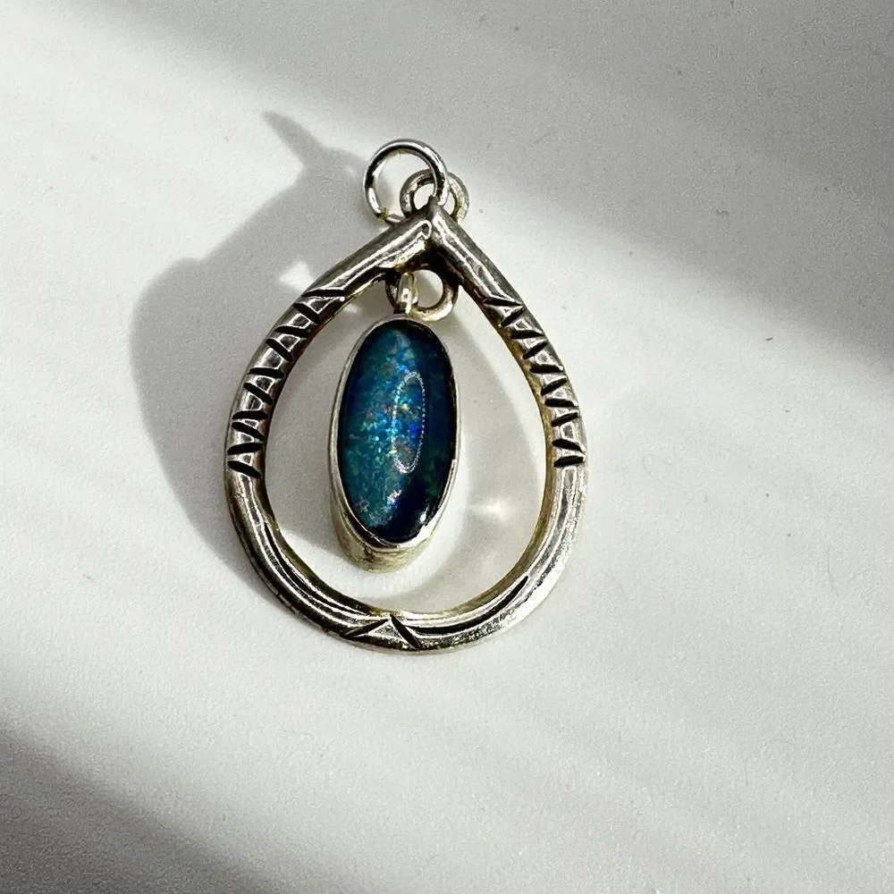 Marked Sterling‎ silver (HTS) and opal in resin pendant!